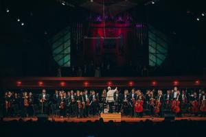[Symphony Orchestra members standing on stage at the UNT College of Music Gala]