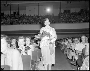 [Shirley Boone holding a bouquet]