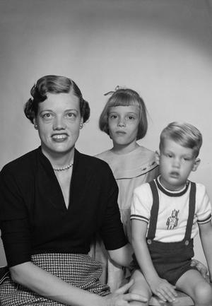 [Evelyn Leguerrier Vinson with her two children, her son blurry]