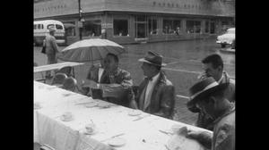 [News Clip: Jaycees enjoy breakfast in the rain]