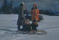 Photograph: [A family with a sled]