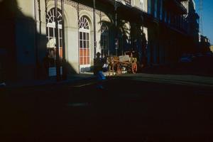 [A horse-drawn carriage in New Orleans]