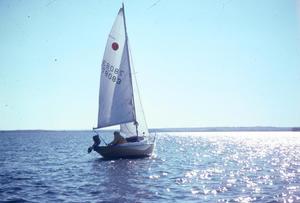 [Man navigating his sailboat, 2]