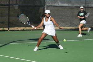 [Idalina Franca swings racket during tennis match, 2]