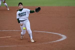 [North Texas softball player pitches during a game]