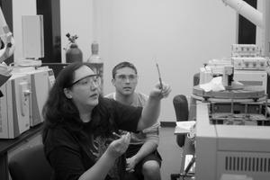 Primary view of object titled '[Photograph of two UNT students using forensic science equipment]'.