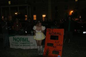 [Photograph of UNT student with NORML banners at Fright Fest]