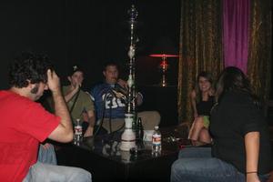[Photograph of UNT students at a hookah lounge]