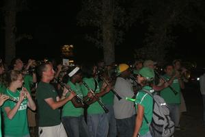 [Photograph of the Green Brigade Marching Band performing at pep rally]