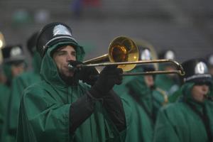 [Trombone player performing at a football game]
