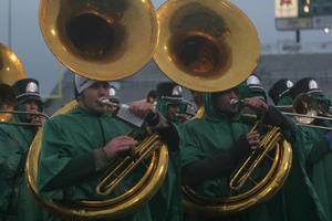 [Sousaphone players performing at a football game]