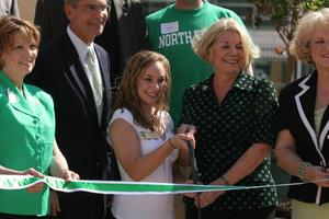 [Dana Cardone and Gretchen Bataille prepare to cut ribbon at Legends Hall opening, 2]