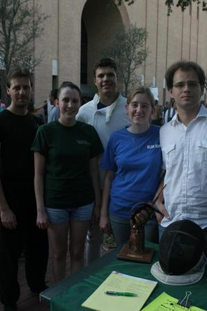 [UNT Fencing Club members stand behind booth during Mean Green Fling]