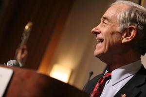 [Photograph of Ron Paul smiling]