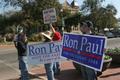 Photograph: [Photograph of a group holding Ron Paul signs on the Square]