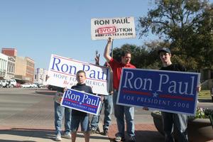 [Photograph of a group holding Ron Paul signs on the Square 3]