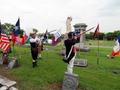 Thumbnail image of item number 1 in: '[Color Guard performs musket salute during grave marking ceremony for C. B. Dorchester]'.