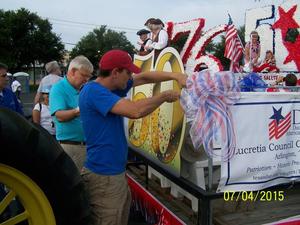 [TXSSAR members decorate 2015 Arlington 4th of July Parade float]
