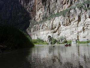 [People canoe in Big Bend canyon mouth]