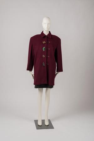 Coat with novelty buttons