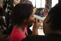 Photograph: [Student gets stage makeup done at 2016 TBAAL Summer Youth Arts Insti…