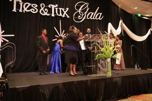 [Cassi Davis on stage with Terrance Dean, Ties and Tux 2014, 5]