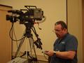 Photograph: [CMP staff member 1 operates video camera, 3]