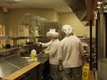 Photograph: [SMHM students prepare food at The Club, 3]