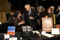 Photograph: [Attendees at auction table, 2008 Emerald Ball, 4]