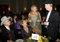 Photograph: [Gretchen Bataille with guests at table 19, 2008 Emerald Ball, 2]