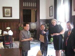 [Charn Uswachoke, Gretchen Bataille, and Vish Prasad with man at Thailand delegation's meeting]
