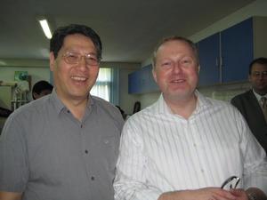 [Two men in lab during UNT delegation visit to China]