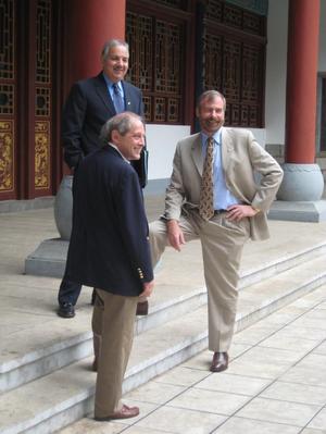 [Thomas Evenson and Warren Burggren with man during UNT delegation visit to China]