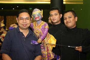[Pijarn Charoensri poses with Thai puppet]