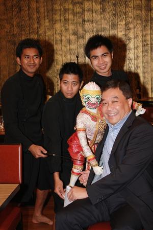 [Kamchorn Lehmongkol poses with Thai puppet]