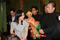 Primary view of [Female audience member poses with Thai puppet]