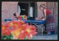 Primary view of [Massage manager giving a cyclist a massage: Lone Star Ride 2002 event photo]