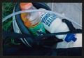 Primary view of [Bottles in a riders helmet: Lone Star Ride 2002 event photo]