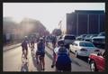 Photograph: [Cyclists biking into the sun down University Blvd: Lone Star Ride 20…