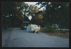 [Janie Bush's car down the road: Lone Star Ride 2002 event photo]