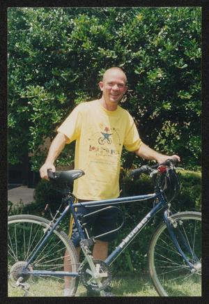 [Man in a yellow LSR t-shirt: Lone Star Ride 2003 event photo]