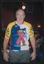 Photograph: [Cyclist smiling in his jersey: Lone Star Ride 2003 event photo]