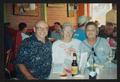 Primary view of [Assistant crew director and two others at a restaurant: Lone Star Ride 2003 event photo]