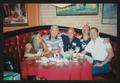 Primary view of [5 people seated around a round booth table: Lone Star Ride 2003 event photo]