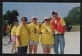 Photograph: [Four crew members in yellow LSR t-shirts: Lone Star Ride 2003 event …