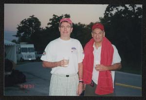 [Two men drinking from Starbucks cups: Lone Star Ride 2003 event photo]