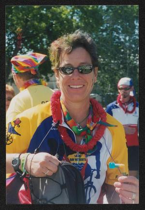 [Portrait of a rider holding their water bladder nozzle: Lone Star Ride 2003 event photo]
