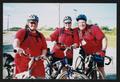 Photograph: [3 cyclists all matching in red: Lone Star Ride 2003 event photo]