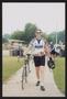 Photograph: [Cyclists walking with their bikes: Lone Star Ride 2004 event photo]