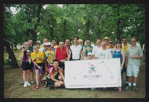 [Large group of individuals gathered behind an LSR banner: Lone Star Ride 2004 event photo]
